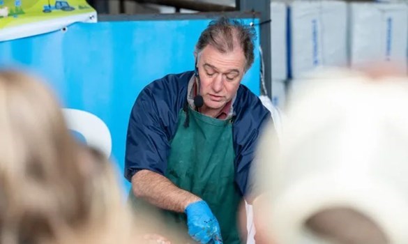Ben Strugnell speaking at an event and conducting a post mortem.
